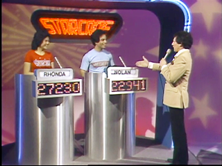 Nolan with his opponent Rhonda Yap and Host Mark Richards during the taping of Starcade.